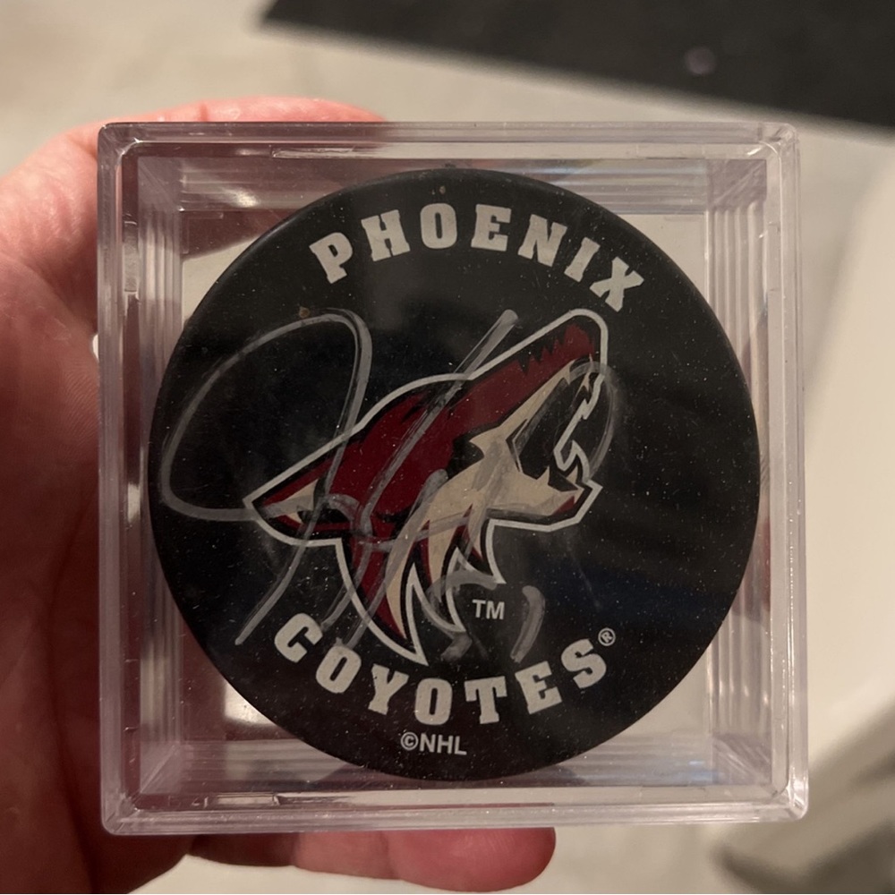 Jeremy Wick, number 97 autographed authentic Phoenix coyotes hockey puck.